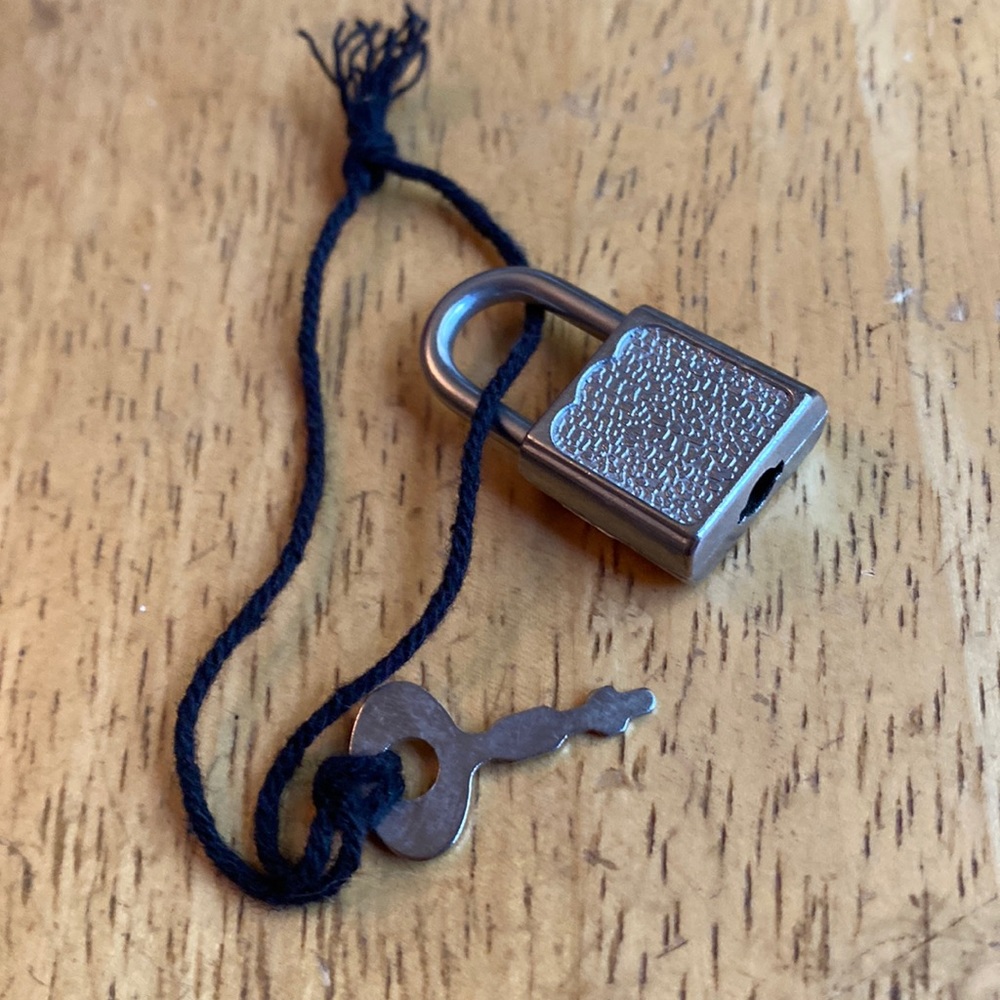 The lock in pre-owned condition, silver tone